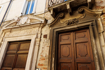 Old doors in the historic center of Renaissance city Urbino, Marche, Italy, Europe