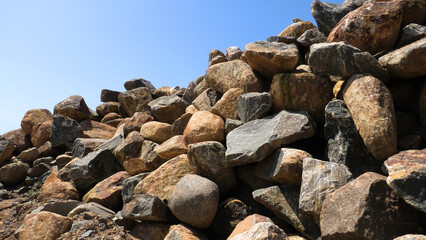 Large rocks piled up at a construction site