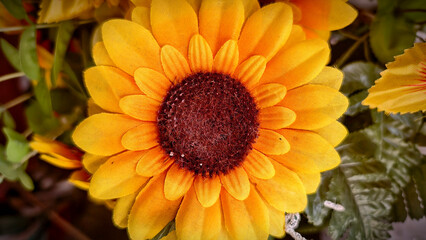 artificial Close-up of a Vibrant Sunflower, a Burst of Color and Texture , The Allure of Artificial Sunflowers: Captivating Petals and Dark Center