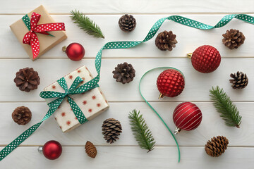 Festive holiday gifts and ornaments create a joyful Christmas spirit on wooden table, top view PNG