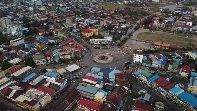 Drone Forward Push-In to Kampot Durian Roundabout with City View, Cambodia