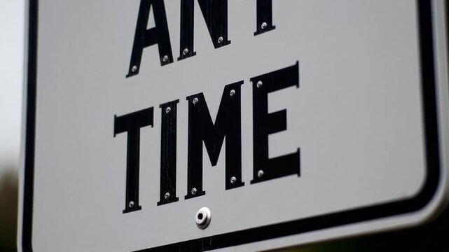 Roadside Signage Displaying the Words Any Time'