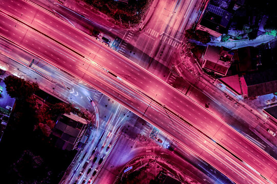 Expressway, Self-driving autonomous electric cars of the future with elements move along a busy traffic intersection. Artificial Intelligence, Car Scan, GPS Tracking, Smart Roads, IoT, highway