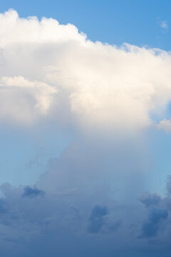 Vertical photo of beautiful dramatic cloudscape background dark and bright high Cumulonimbus clouds.