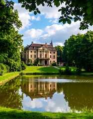 Obraz premium A picturesque estate with a grand house reflecting serenely on a tranquil pond, bathed in the soft light of a summer day.