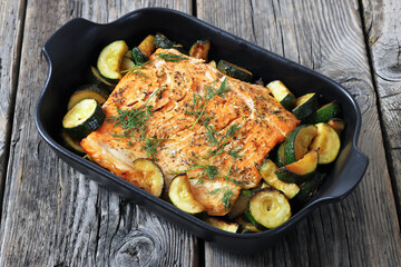 freshly baked salmon fillet with zucchini and dill