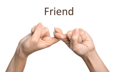 Woman showing word Friend on white background, closeup. Sign language