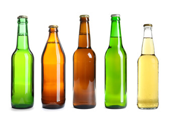 Different types of fresh beer in glass bottles isolated on white, set