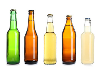 Different types of fresh beer in glass bottles isolated on white, set