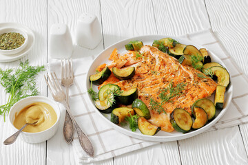 freshly baked salmon fillet with zucchini and dill