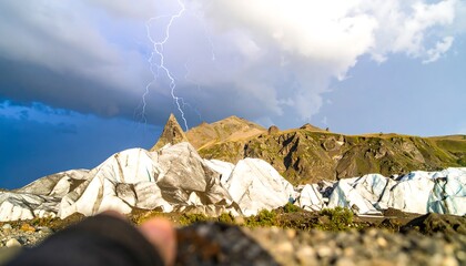 Dramatic Lightning Strike Over Rugged Mountain Landscape.