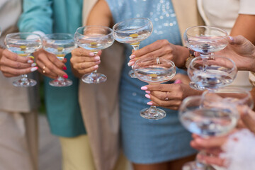 A Celebration Toast featuring beautifully crafted Champagne Glasses filled with bubbly drink