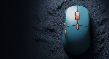 Sleek teal wireless mouse on dark gritty surface