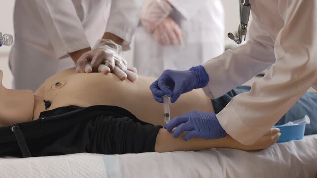 Medical professionals examining object on table
