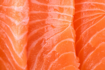 Fresh, juicy salmon cut into pieces for sashimi