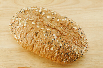 Whole Grain Bread Freshly baked bread topped with flax seeds and sunflower seeds