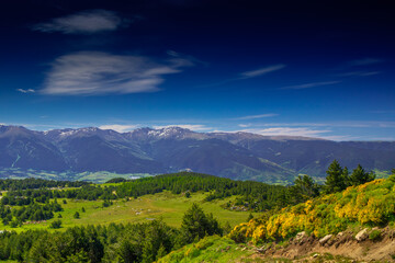 Obraz premium Mountain landscape of the Pyrenees in summer in the South of France. Pastures and forests in Font Romeu.