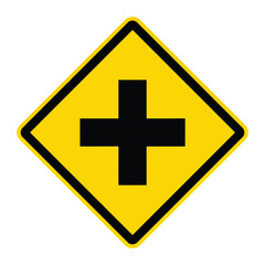 Fototapeta premium Yellow diamond intersection warning sign with black cross symbol road safety alert