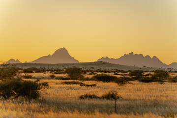 Beautiful Namibian Mountains Glowing in Golden Hour Sunset © Taskina