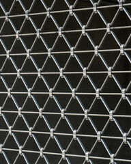 Close up of iron bars on window, symbol of security and protection. Architectural detail of building facade, urban safety concept, home defense, anti theft design element.