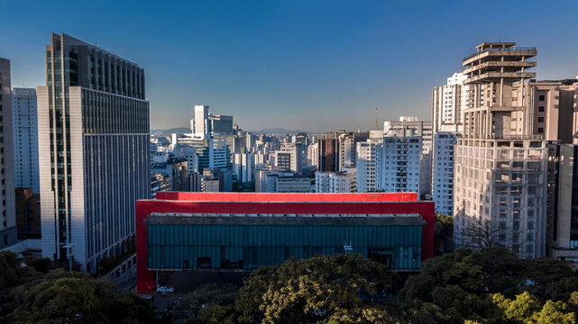 Aerial drone view of MASP Museum of Art S&atilde;o Paulo on Paulista Avenue, Brazil, with modern city skyline, skyscrapers and blue sky, captured with DJI Mavic 3