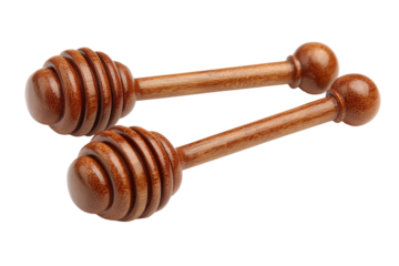 Two honey dippers, light brown wood, honeycombs, isolated