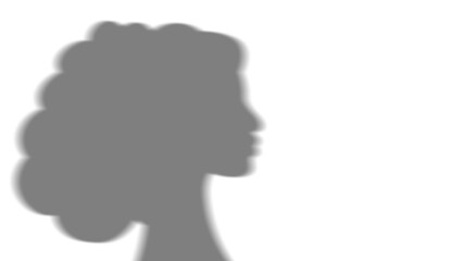 overlay of the shadow of a woman's head in silhouette