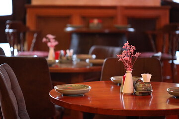 A decorative table with a beautiful vase of flowers
