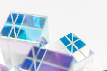 Intersecting lines and prismatic reflections on transparent cubes in blue and purple tones, forming a sleek abstract composition with geometric elegance for tech, design or visual art applications