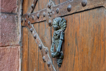 Angelic Embrace on a Wooden Door
