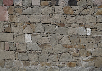 Old stone wall pattern texture or background. Backdrop of stone rock fence floor textured exterior surface.