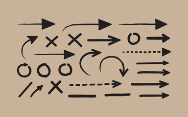 Collection of hand drawn arrows and symbols on a textured background