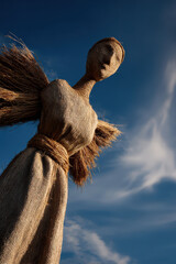 straw angel elegantly crafted radiating warmth and charm perfectly set against ultrabright clear blue sky