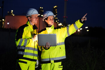 Petrochemical or refinery engineer teamwork celebration after success working plan at petroleum oil...