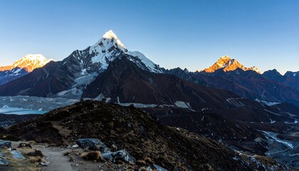Fototapeta premium Majestic Himalayan Peaks Bathed in Golden Sunrise Light.