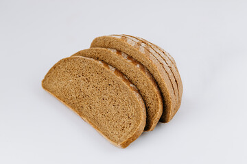 Sliced rye bread loaf isolated on white background, healthy whole grain bakery product