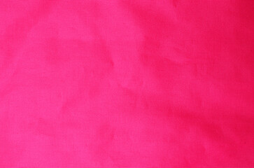 Smooth bright red synthetic fabric textile background used as soft surface for modern fashion design and stylish decorative concepts