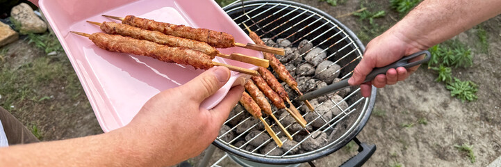 Grilling aromatic skewers on charcoal, savoring summer barbeque essence, mid-century Rhein in Flammen festival meets global Kebab Day