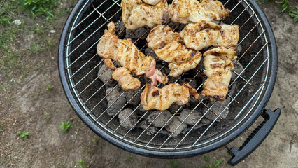 Succulent grilled chicken sizzles over charcoal, evoking midsummer barbecue gatherings and the smoky allure of Meatopia Festival cooking