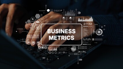 Hands Typing on Laptop with Overlaid Graphics of Business Metrics and Data Analysis Concepts. Asymptotic smart data analytic.