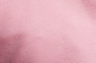 Smooth light pink polyester fabric textile background used as soft surface for modern fashion design and stylish decorative concepts
