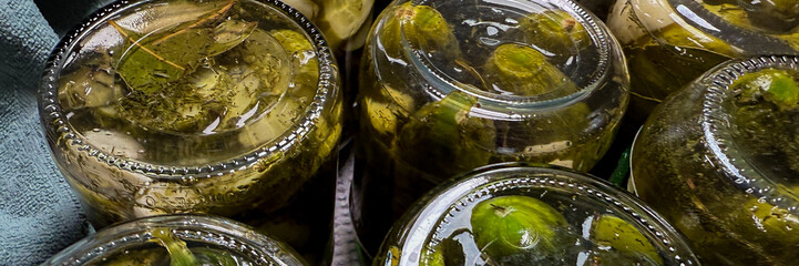 Glassy jars brimming with pickles and herbs, capturing harvest fervor and culinary magic, perfect for International Pickle Day celebrations
