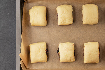 Raw poppy seed buns raw pastry dough baking sweet dessert tasty snack fresh delicious gourmet food background on the table rustic top view copy space