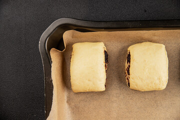 Raw poppy seed buns raw pastry dough baking sweet dessert tasty snack fresh delicious gourmet food background on the table rustic top view copy space