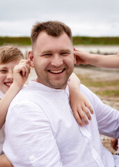 Fototapeta premium Happy family spending good time at the beach together,