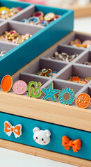 Playful colorful enamel rings in charming teal jewelry box