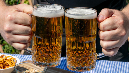 Two frothy mugs clink in jubilant camaraderie, embodying the Oktoberfest spirit and the quirky charm of beer-tasting rituals