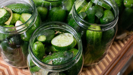 Pickled cucumbers bask in brine-filled jars, evoking tangy echoes of Oktoberfest zest and Slavic...
