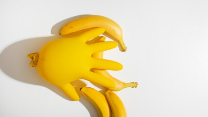 Playful banana still life with yellow glove, surreal hybrid concept, celebrates World Creativity...