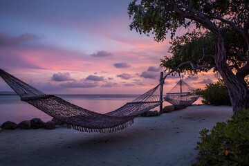 Obraz premium Hammock beach sunset vacation, relaxing tropical island getaway travel destination